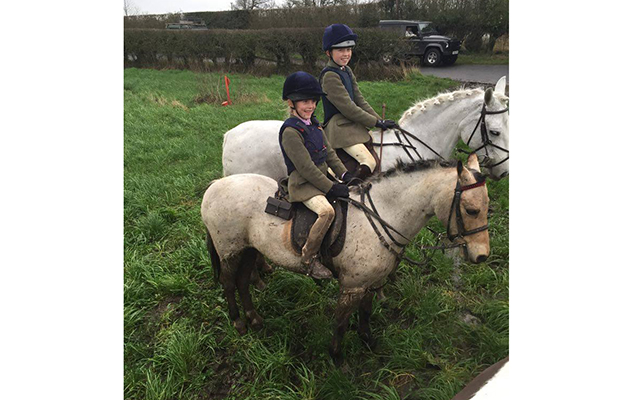 Sisters Martha German (11) on Poppy and Felicity German (6) on 26-year-old Sugar Puff enjoy at day with the Cheshire Forest where their father Andrew hunts the hounds