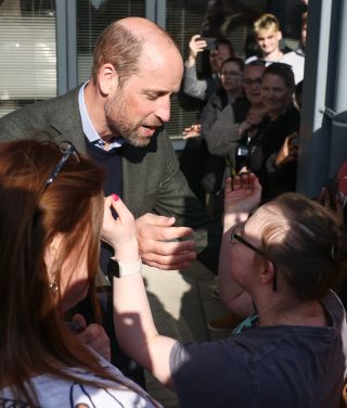 Prince William embraces fan Natasha Gorry during visit to Homewards Bournemouth, Christchurch and Poole (BCP) on February 28, 2025