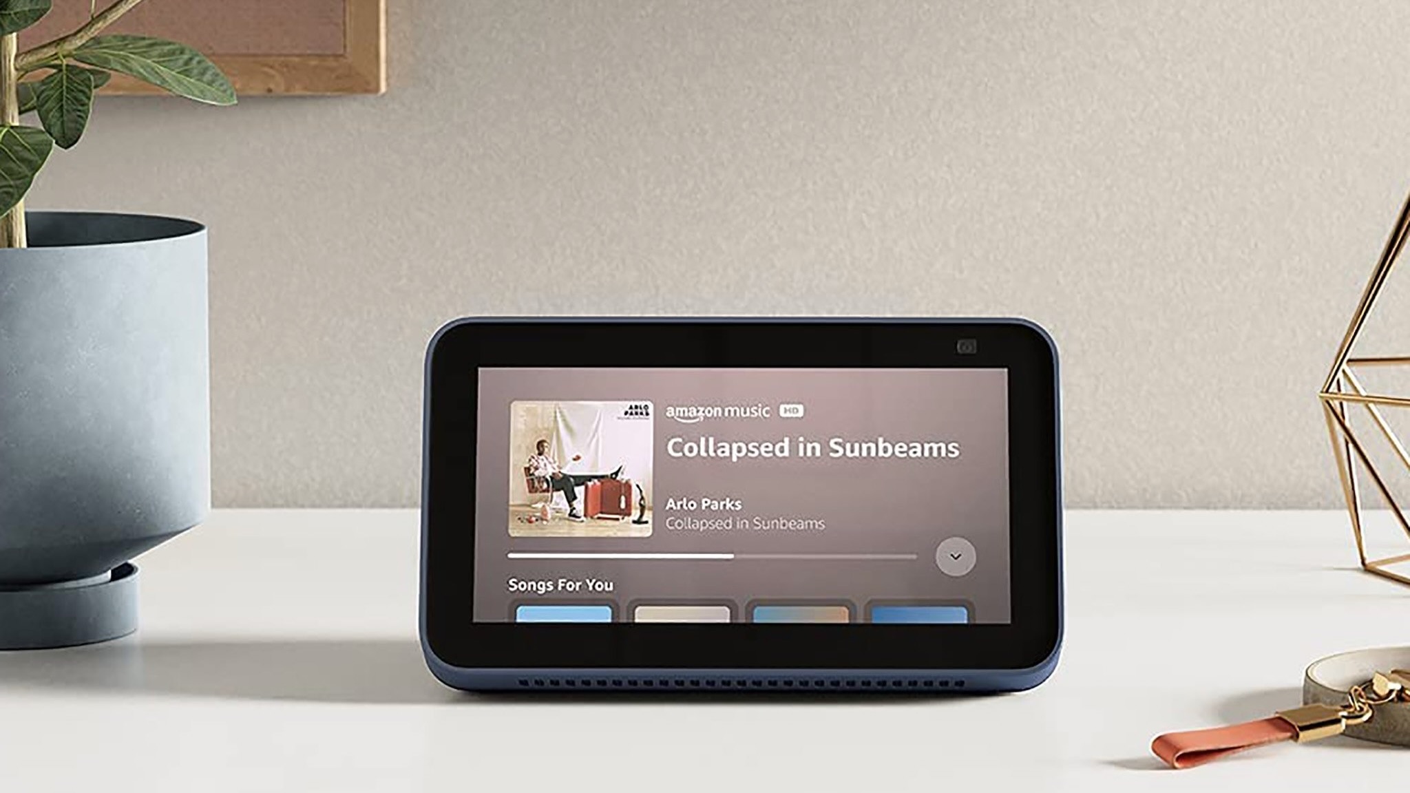 Press photo of the Amazon Echo Show 5 playing a song on Amazon Music