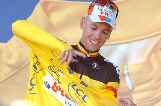 Philippe Gilbert (Omega Pharma-Lotto) pulls the yellow jersey over his Belgian champion's jersey