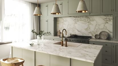 To get your space as organised as this sage green kitchen with marble countertops these are the items interior designers never have in small kitchens