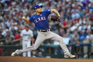 Max Scherzer #31 of the Texas Rangers pitches during Game 3 of the 2023 World Series between the Texas Rangers and the Arizona Diamondbacks at Chase Field on Monday, October 30, 2023 in Phoenix, Arizona. 