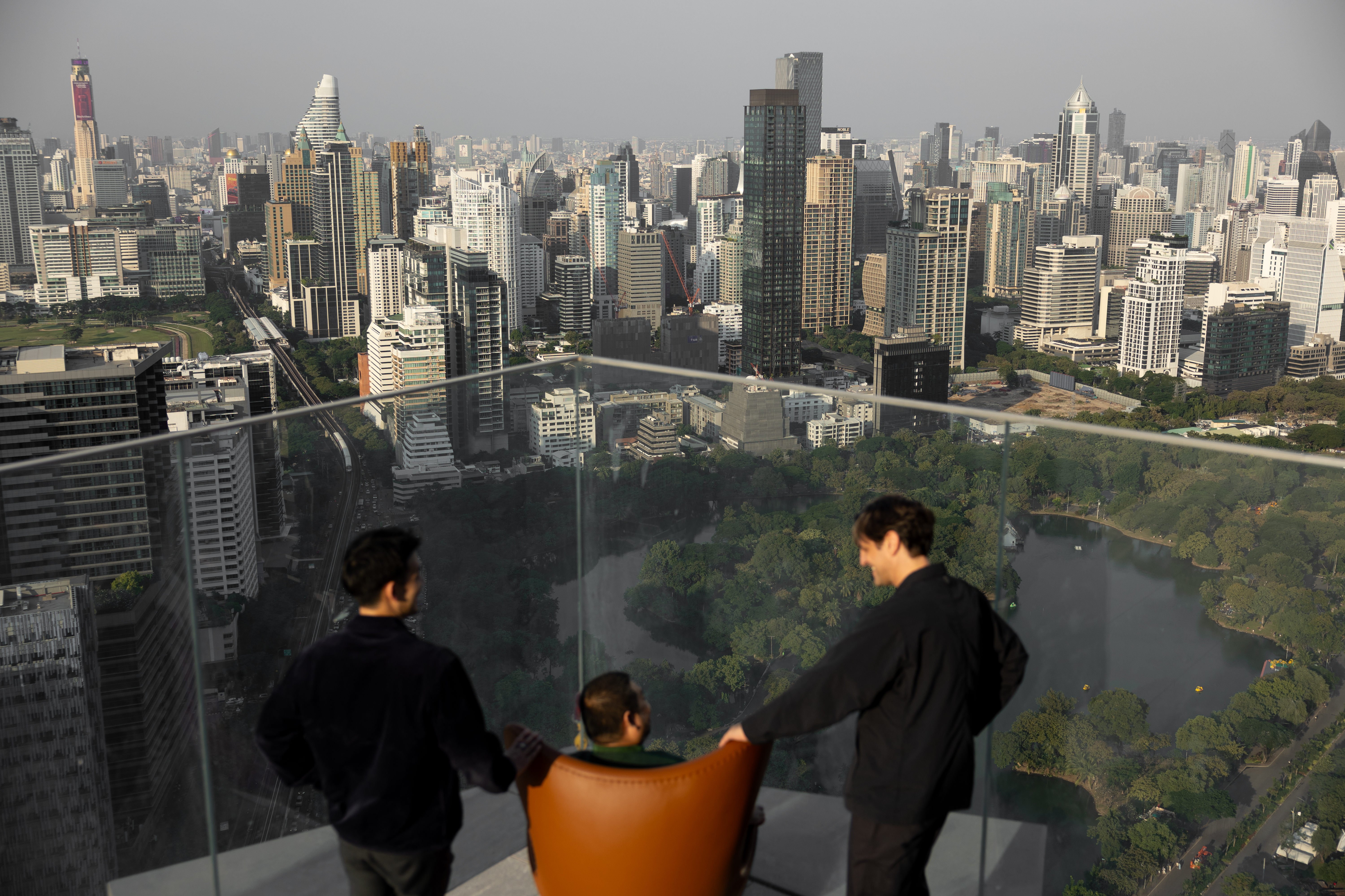 rooftop bar interior with warm wood and Fritz Hansen furniture