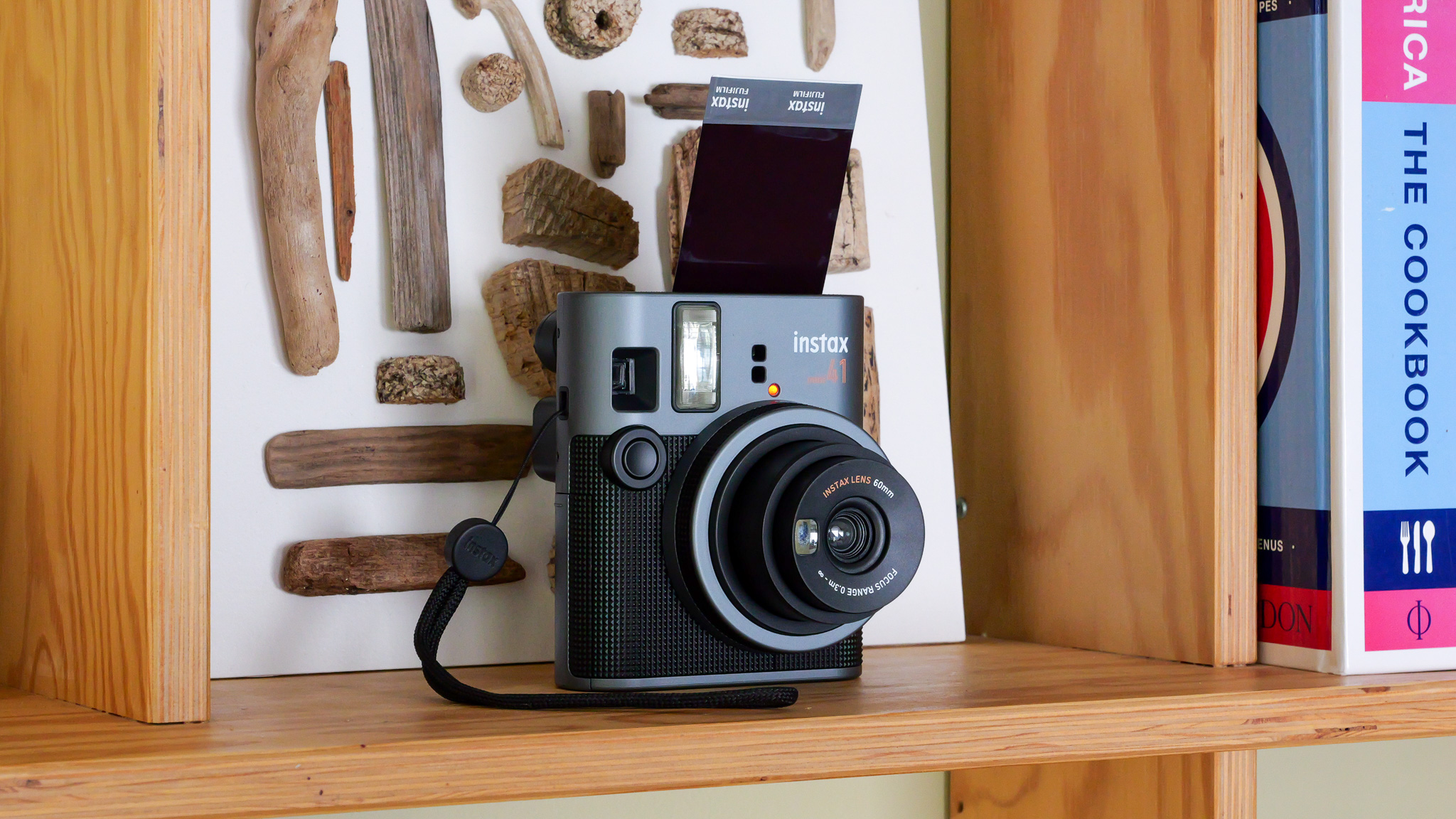 Fujifilm Instax Mini 41 camera on wooden shelf
