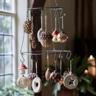 Hanging decoration with pine cones and mushrooms