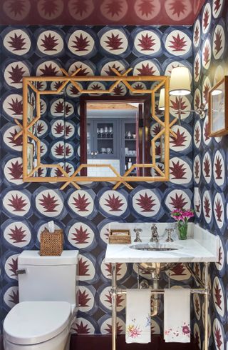 Powder room with blue and burgundy wallpaper and burgundy glossy painted ceiling