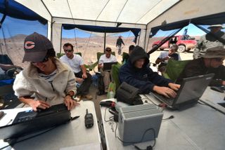 Researchers working under shelter during the SAFER trial in Chile's Atacama Desert in October 2013.