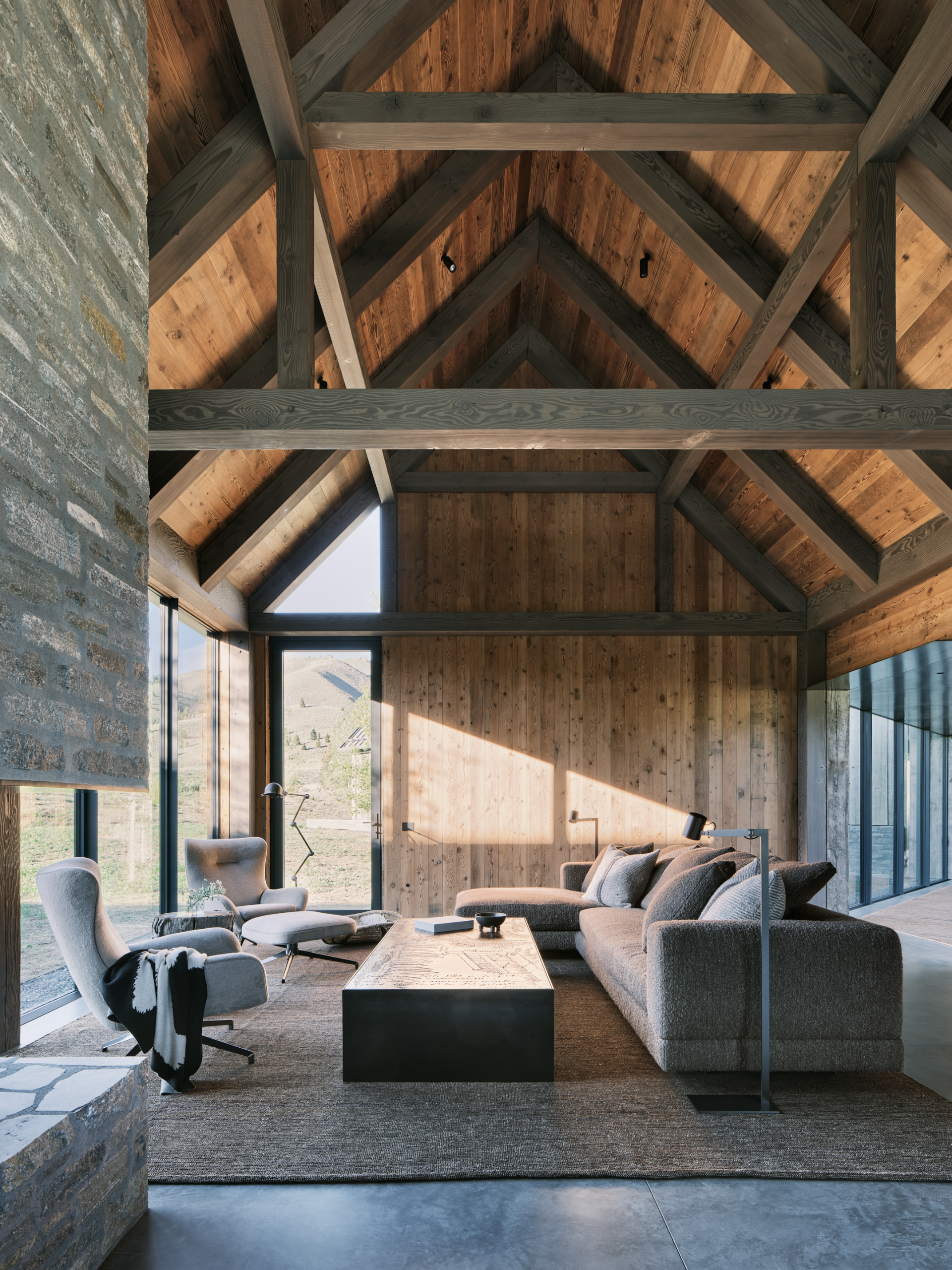 Three Barns by Field Architecture, a rural american home designed to look like a collection of old wooden barns