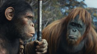 Noa and Raka share a thoughtful moment outdoors in Kingdom of the Planet of the Apes,