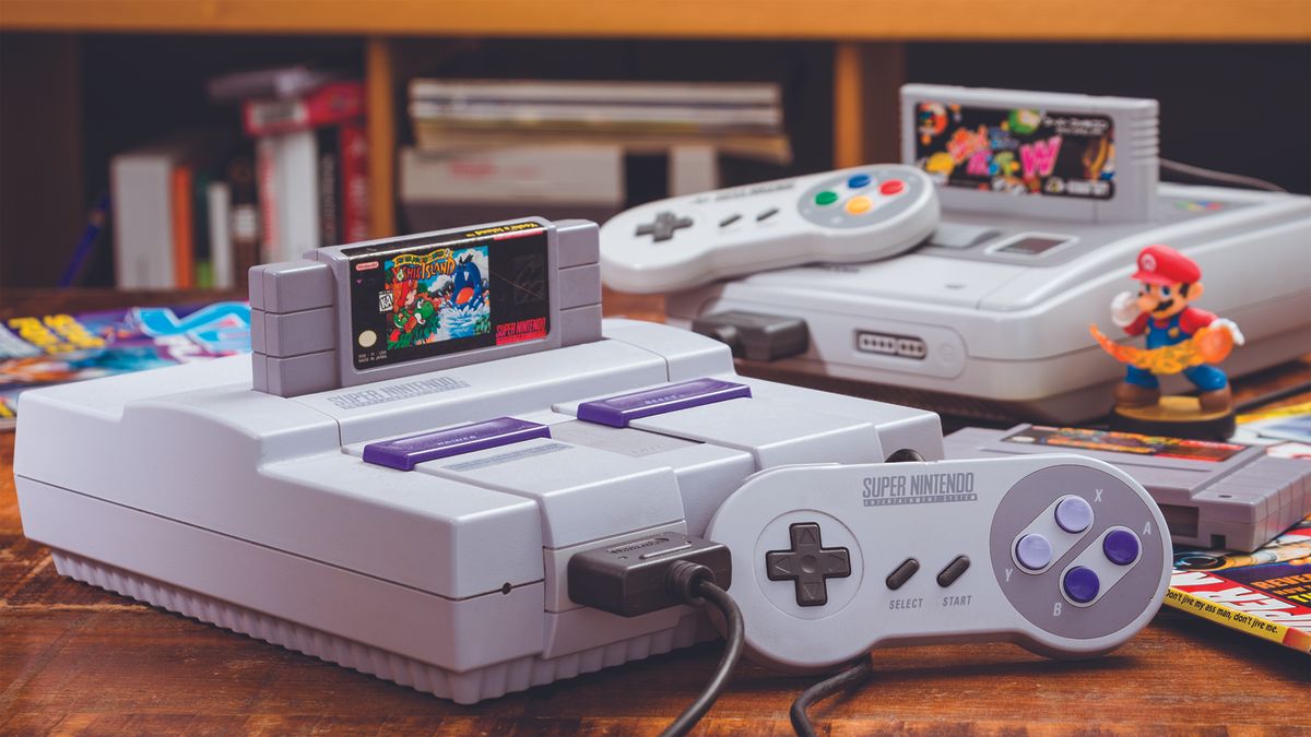 Best SNES games: a screenshot of an SNES console with a Mario figure next to a collection of games. 