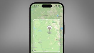 An iPhone on a grey background showing offline Apple Maps in iOS 17