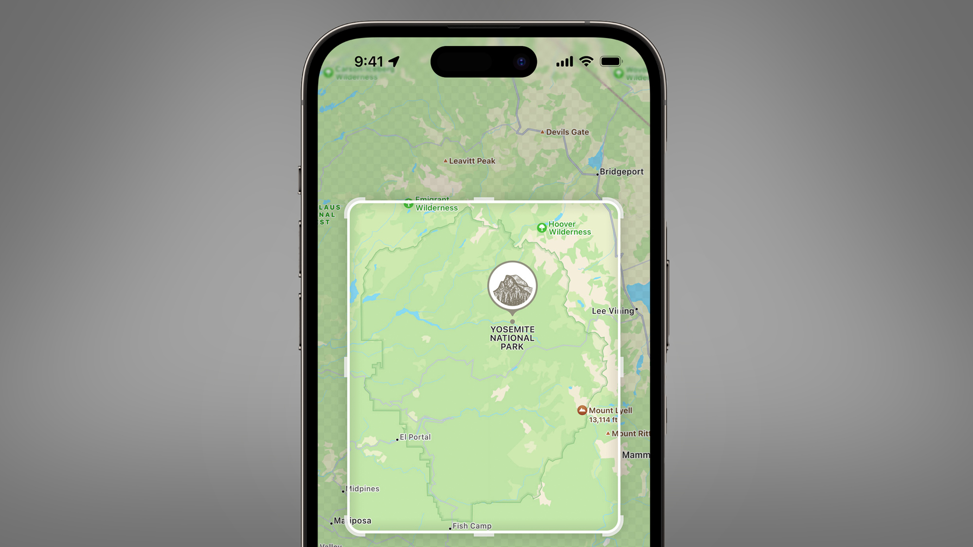 An iPhone on a grey background showing offline Apple Maps in iOS 17