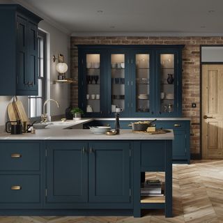 kitchen with bricked wall and deep blue cabinets