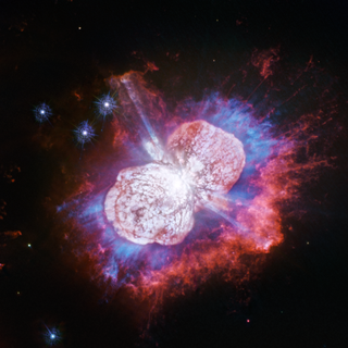 Hubble Telescope's image of Eta Carinae shows its hot gases in red, white and blue colors.