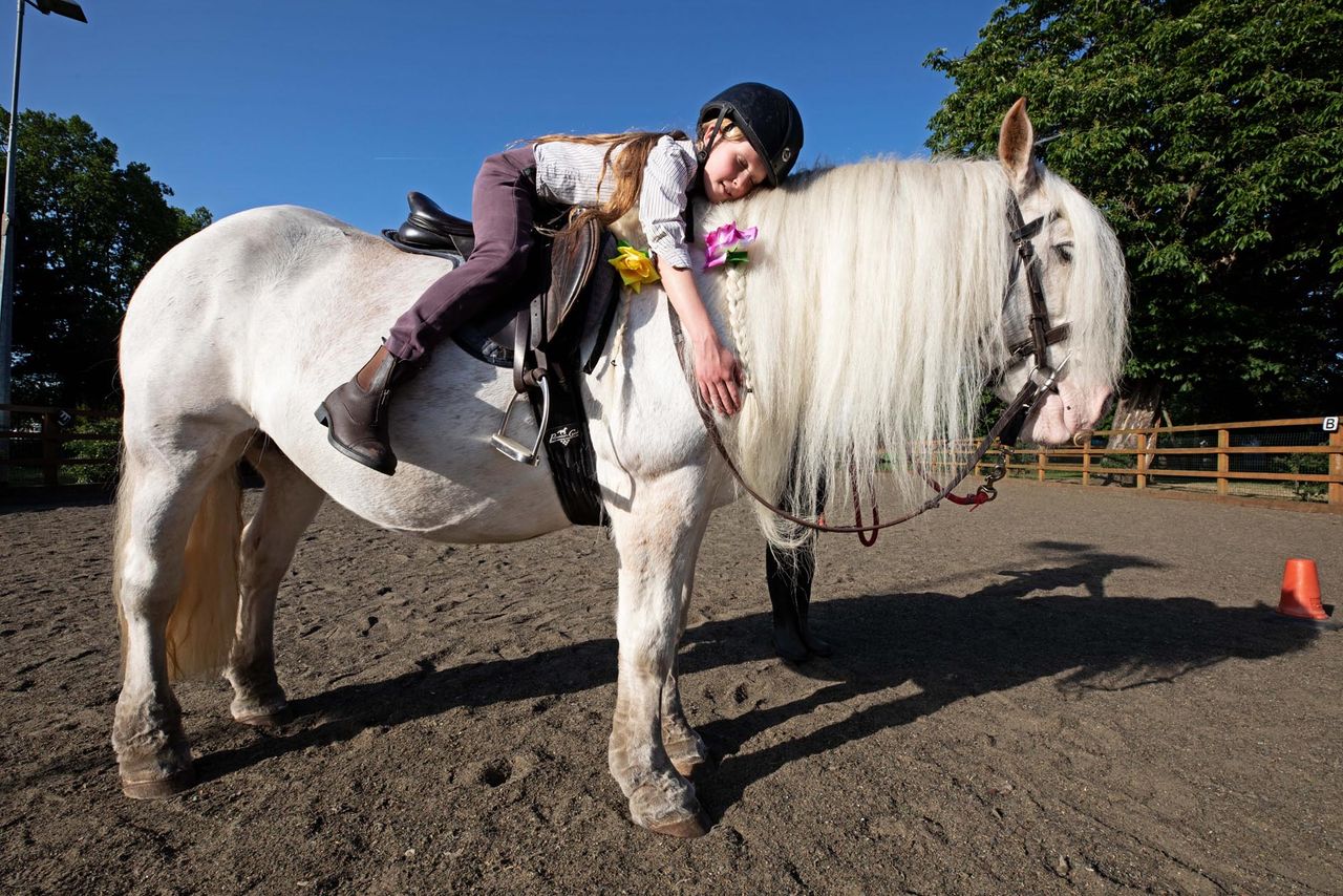 A true bond: Ebony offers vital relief from the clamour of modern life for Marie Scriven. Ebony Horse Club, Brixton, South London. ©Richard Cannon for Country Life