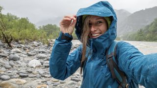 woman hiking in rain