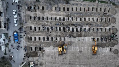 Iranian state media photo showing burial sites for school girls killed in suspected U.S. airstrike on elementary school