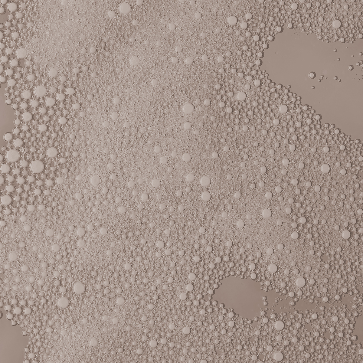 A close up of a skincare serum texture with bubbles