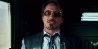Iron Man Robert Downey Jr in a humvee, drinking