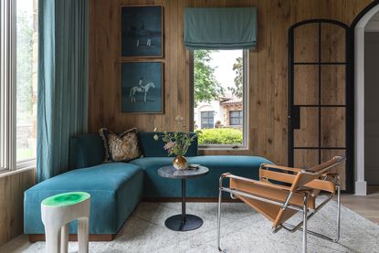 living room with teal sofa and seafoam green coffee table