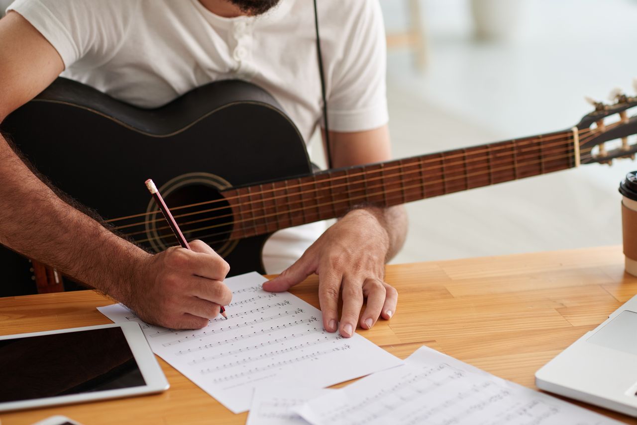 A songwriter works on a song.