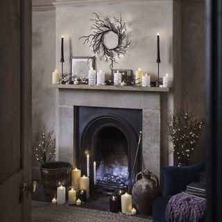 Mantle decorated with electric candles and fairy lights