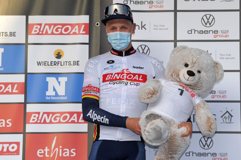 DOUR BELGIUM MARCH 02 Podium Tim Merlier of Belgium and Team AlpecinFenix Celebration during the 53rd Grand Prix Le Samyn 2021 Mens Elite a 2054km race from Quaregnon to Dour Trophy Bear Mascot Mask Covid Safety Measures GPSamyn on March 02 2021 in Dour Belgium Photo by Luc ClaessenGetty Images