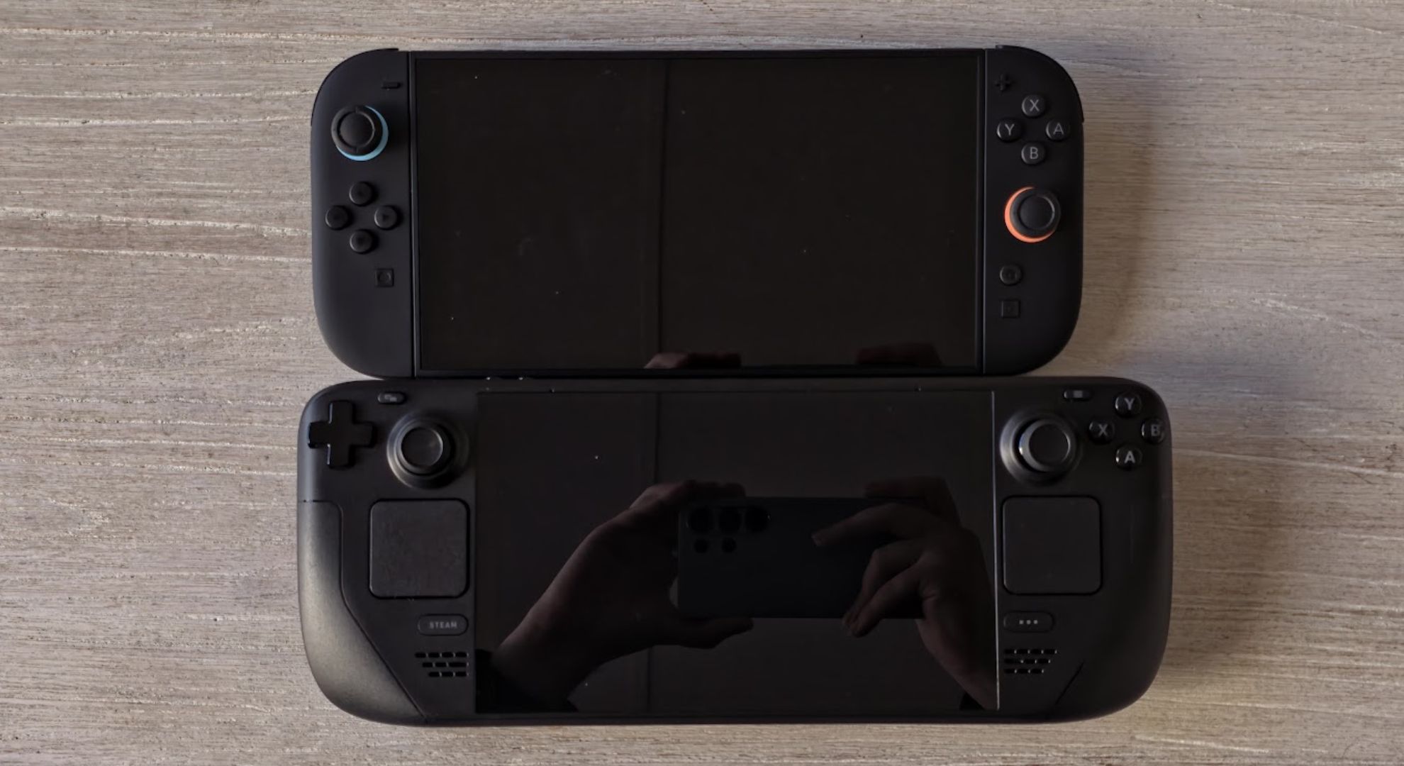 A Nintendo Switch 2 and a Steam Deck on top of each other