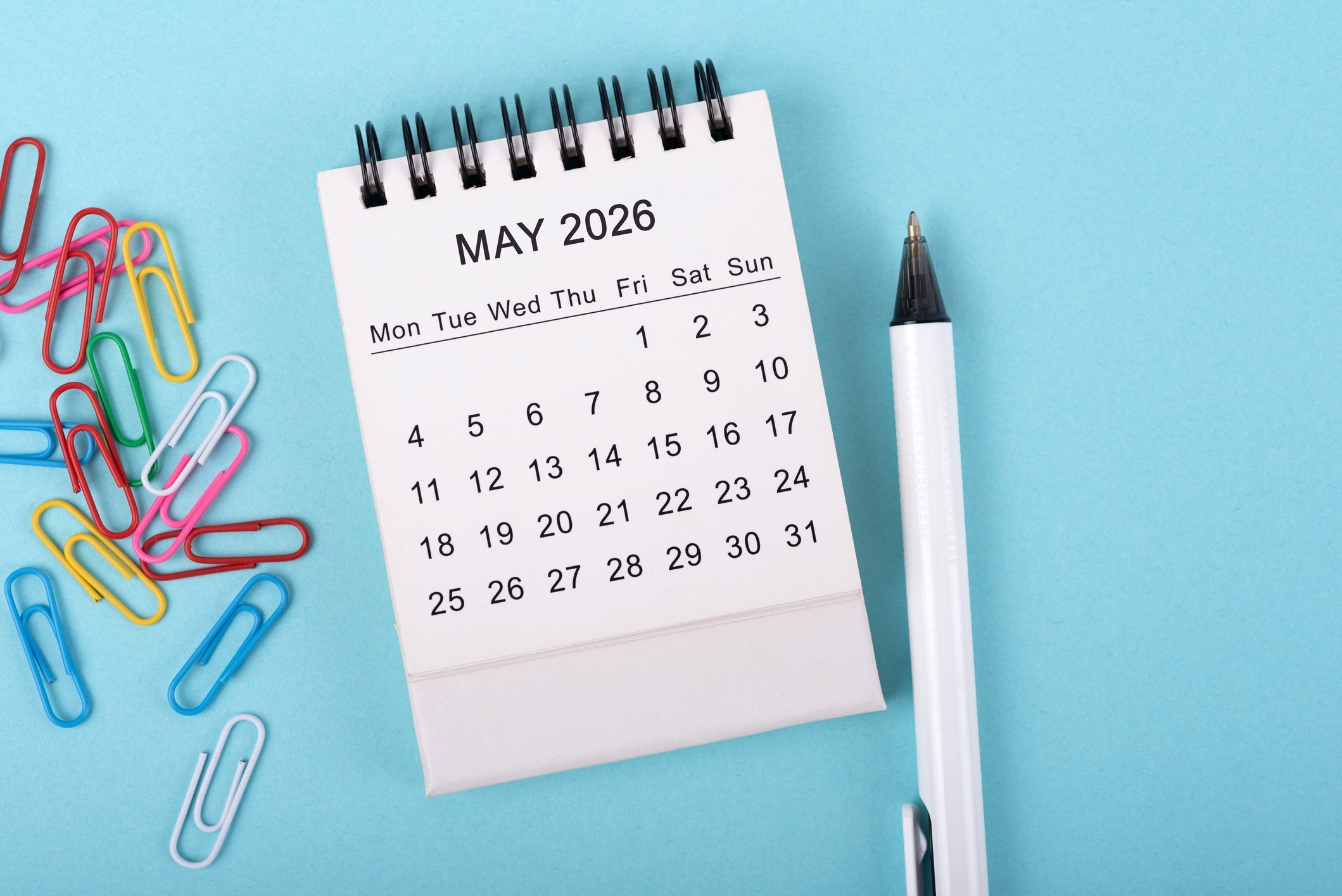May 2026 Desk Calendar on Blue Background