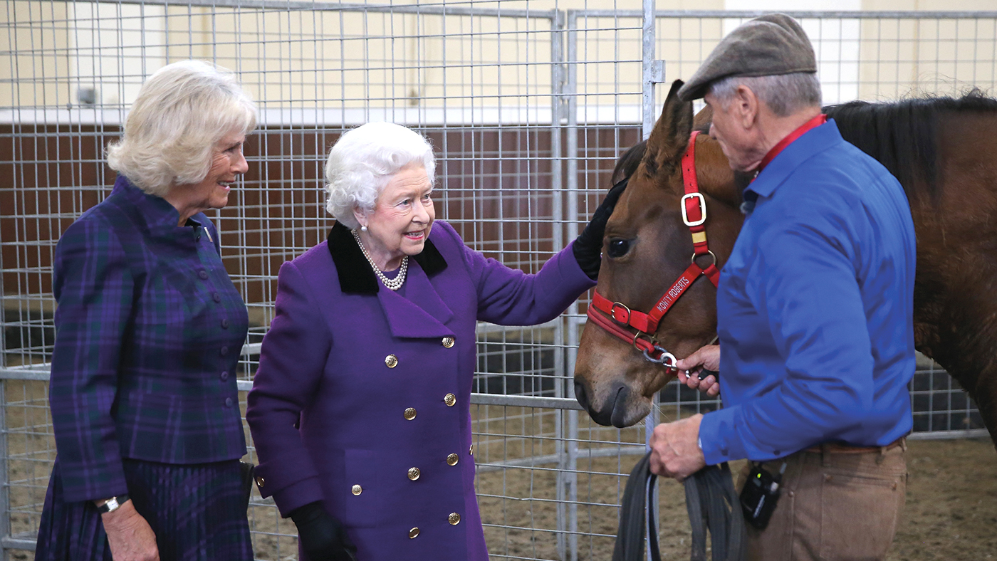 LONDON, ENGLAND - OCTOBER 21: Camilla, Duchess of Cornwall and Queen Elizabeth II attend a horse whispering demonstation by Brooke Global Ambassador Monty Roberts at the Royal Mews, Buckingham Palace on October 21, 2015 in London, England. The Brooke is an international animal welfare charity working to improve the lives of horses, donkeys and mules. (Photo by Chris Jackson-WPA Pool/Getty Images)