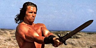 Arnold Schwarzenegger's Conan holding out sword