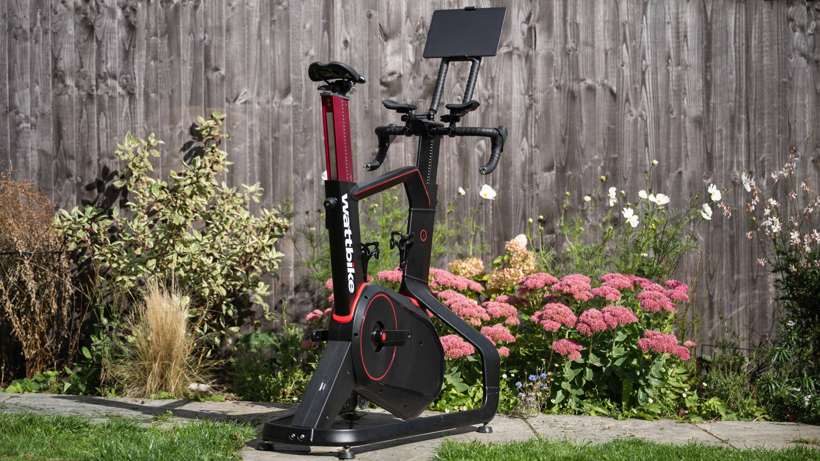 The Wattbike Atom exercise bike in a garden