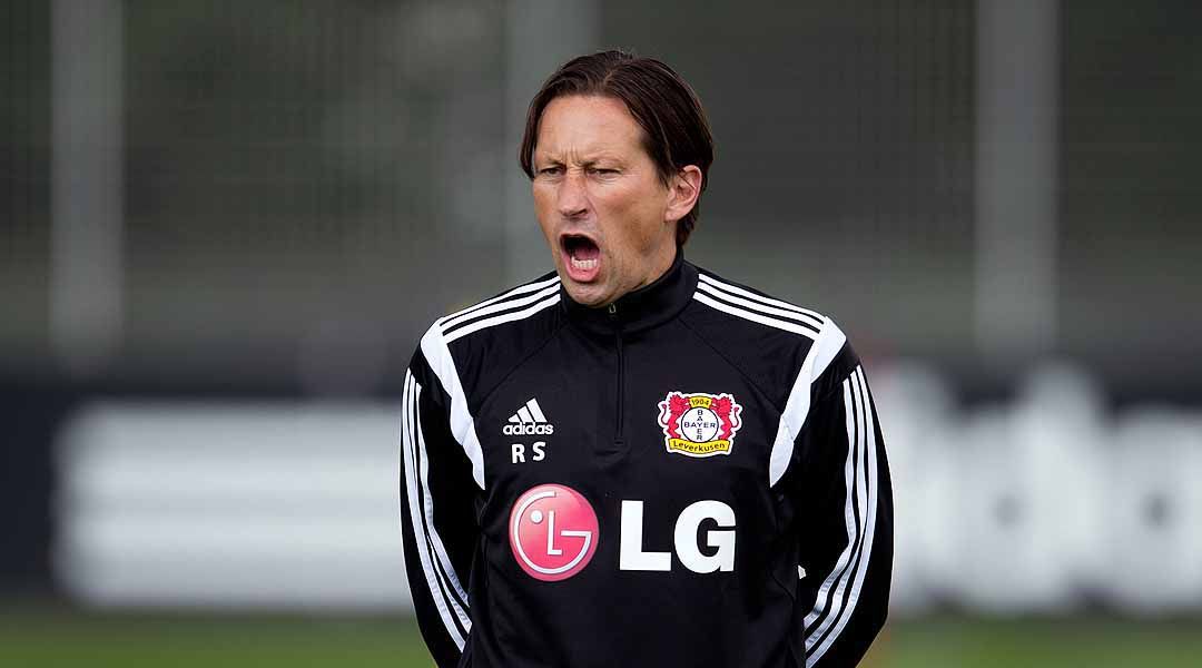 Leverkusen's head coach Roger Schmidt, center right, embraces Leverkusen's  Tin Jedvaj after the Champions League group C soccer match between Bayer 04  Leverkusen and Zenit in Leverkusen, Germany, Wednesday, Oct. 22, 2014.(AP