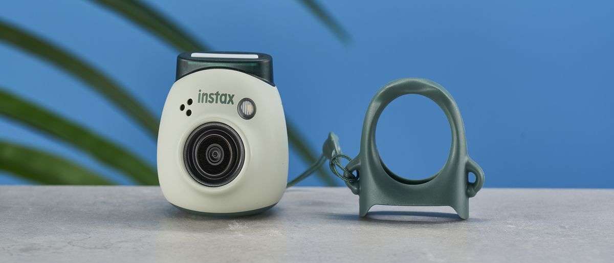 A pistachio green Fujifilm Instax Pal digital camera