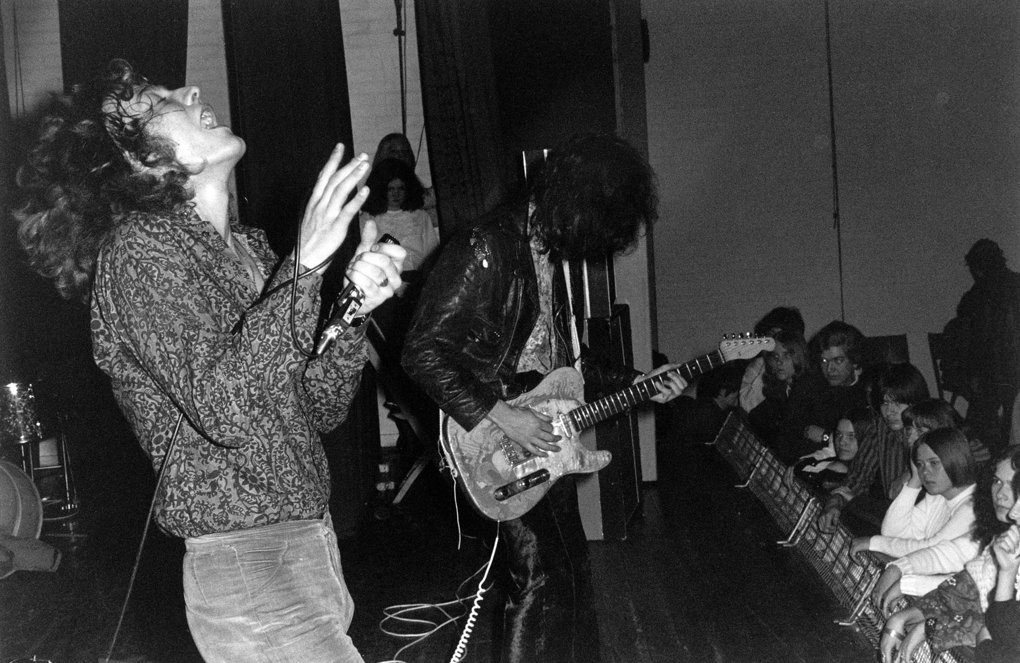 Led Zeppelin's Robert Plant and Jimmy Page perform onstage &amp;ndash; Page's Telecaster has been refinished with his Dragon artwork.