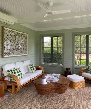 sitting area with jute rug and bamboo sofa