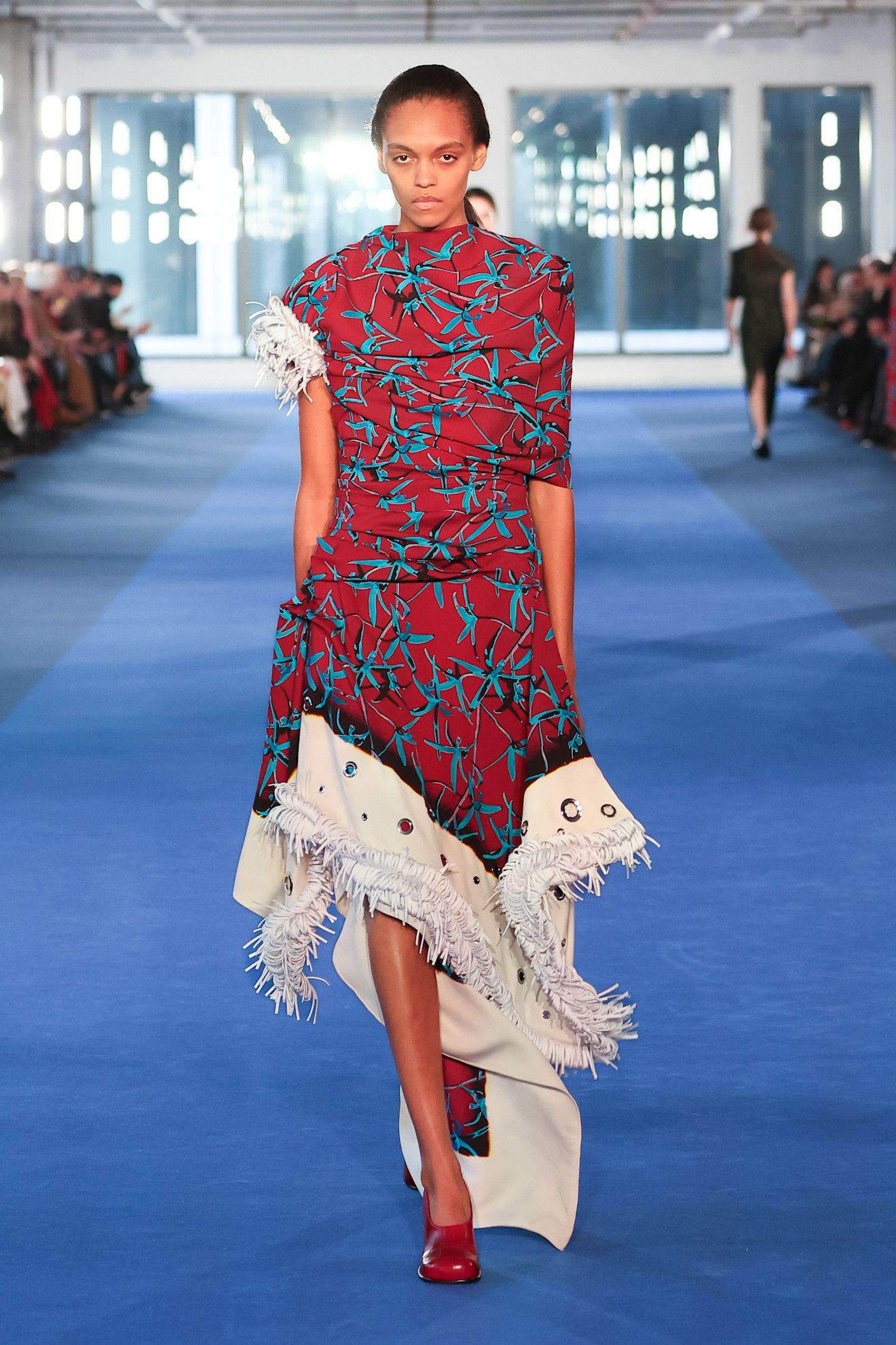 Photo of model wearing printed dress trend from New York Fashion Week Fall Winter 2026 runway show.