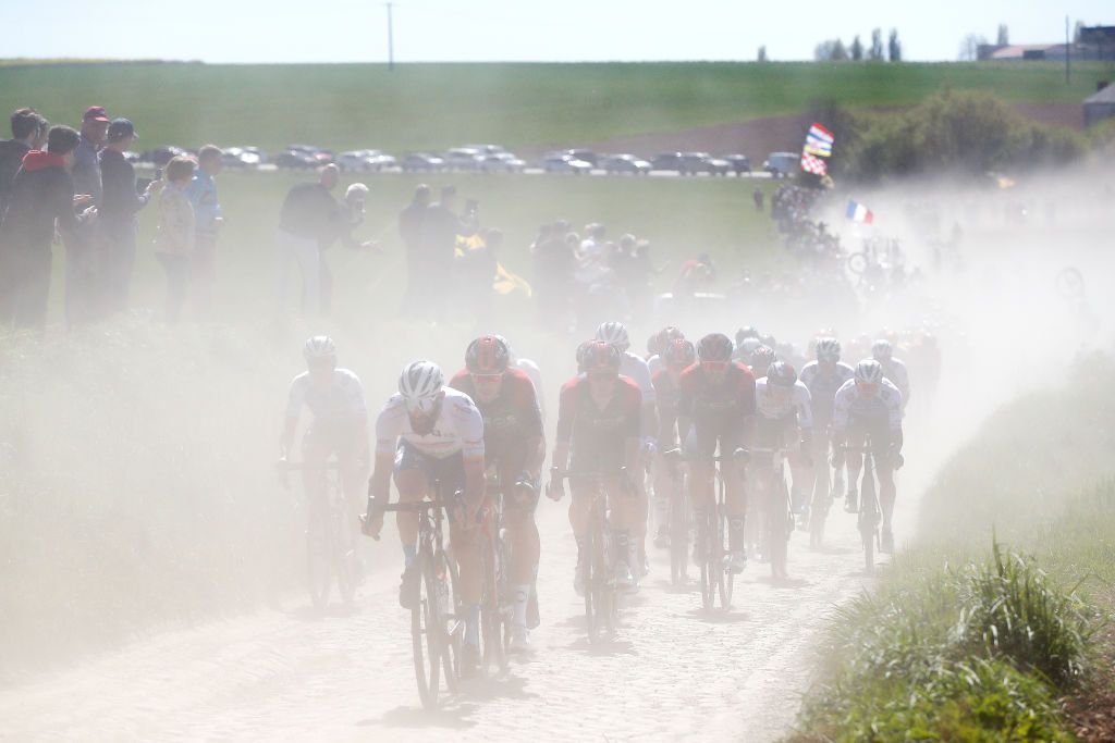 ROUBAIX FRANCE APRIL 17 A general view of Geoffrey Soupe of France and Team Total Energies and the peloton competes passing through a dusty cobblestones sector during the 119th ParisRoubaix 2022 Mens Elite a 2572km one day race from Compigne to Roubaix ParisRoubaix WorldTour on April 17 2022 in Roubaix France Photo by Bas CzerwinskiGetty Images
