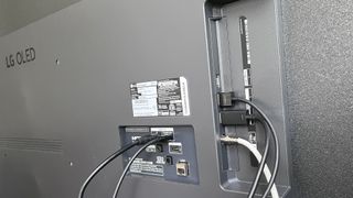 LG B4 OLED TV ports with cables sticking out