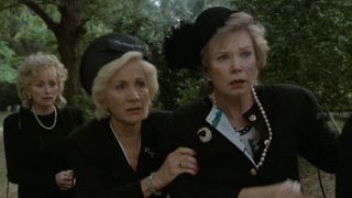 Clairee standing behind Ouiser at the funeral in Steel Magnolias