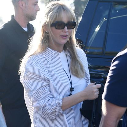 Jennifer Lawrence exits a car wearing a pendant storage necklace