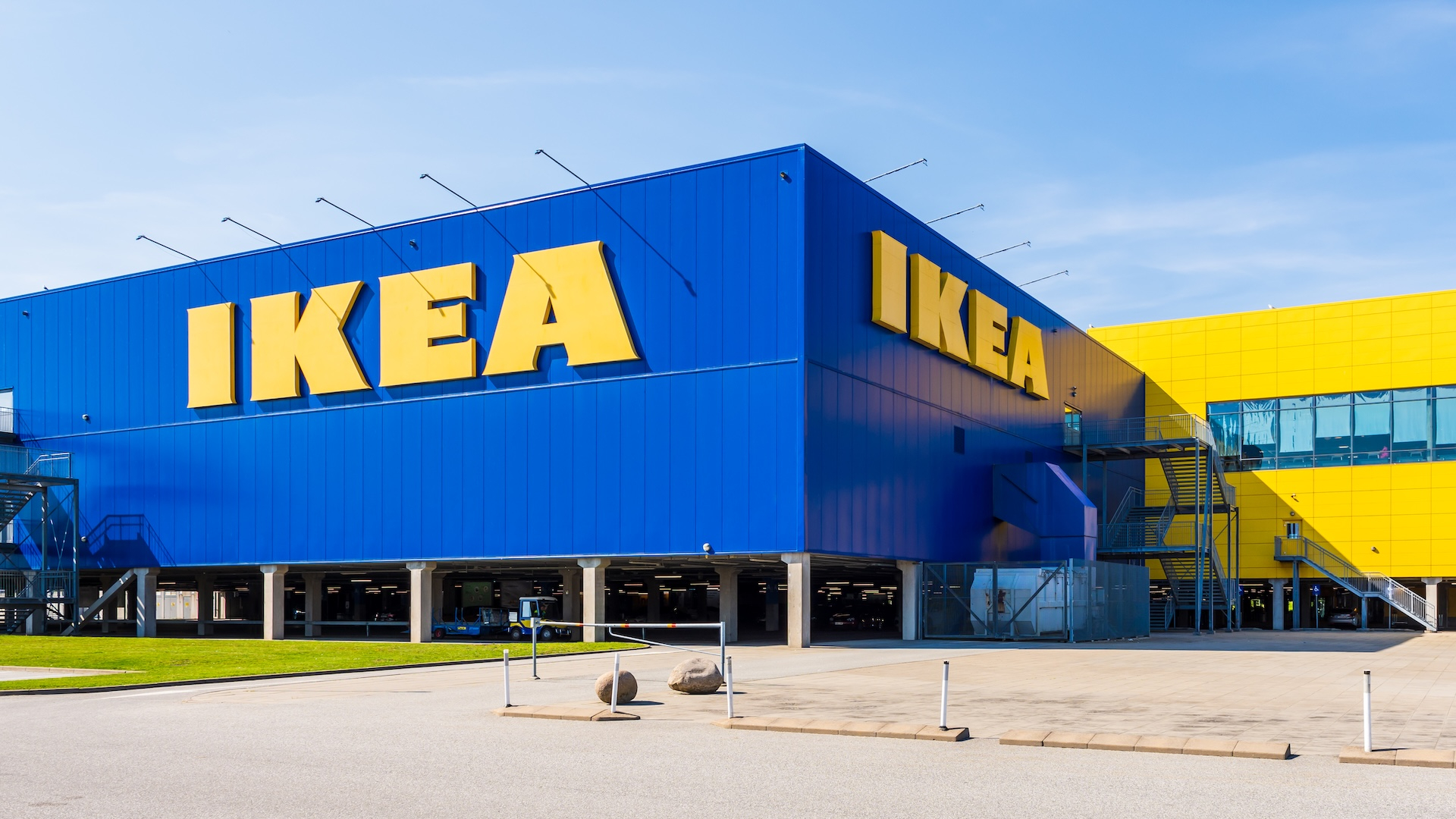 Large IKEA signs on the blue facade of an IKEA store