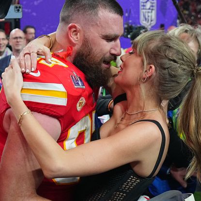 Kansas City Chiefs Travis Kelce (87) kisses girlfriend and singer Taylor Swift following victory vs San Francisco 49ers at Allegiant Stadium. Las Vegas, NV.