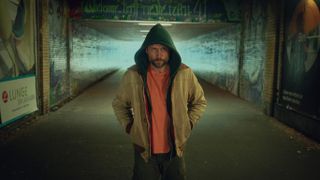 Mike Atlas (Max Riemelt) with his hood up in Sleeping Dog