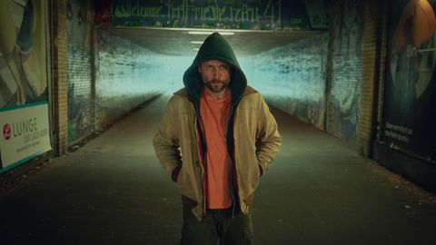 Mike Atlas (Max Riemelt) with his hood up in Sleeping Dog
