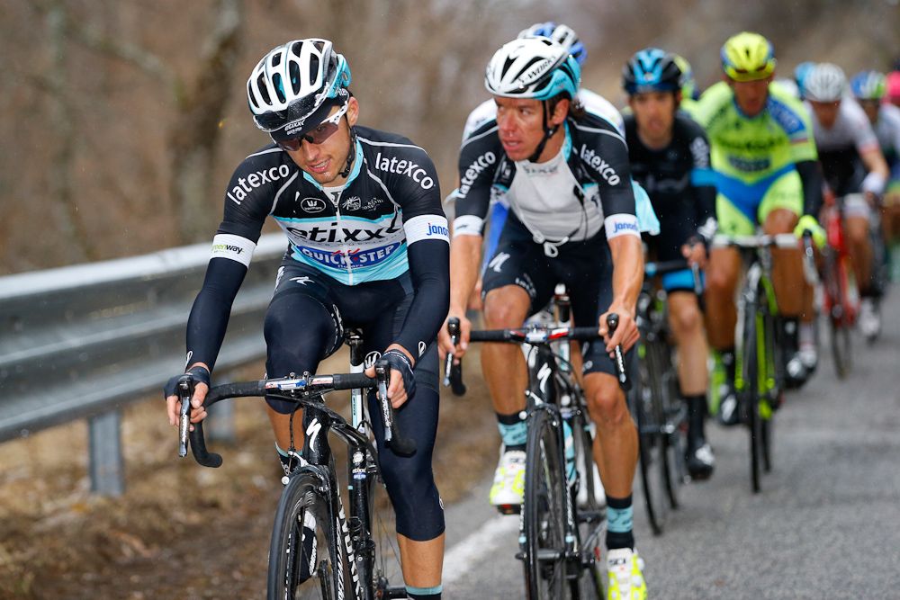 Rigoberto Uran rides behind a teammates.