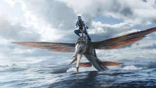 A character in Avatar 2 riding on the back of winged animal over water