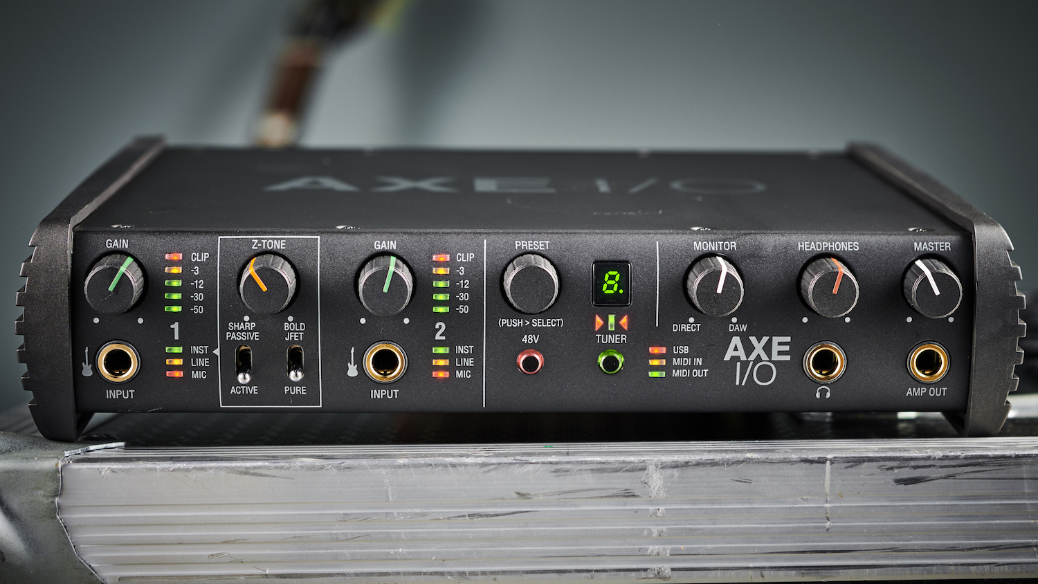 How to choose an audio interface: IK Multimedia X I/O with guitar in background