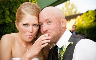 Couple eating wedding cake