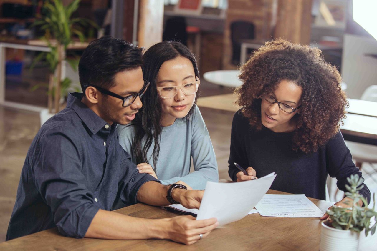 Young couple talking to a financial adviser